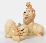 Two Nao porcelain figurines in Disney Lion King style of lions and cubs. 14cm tall.