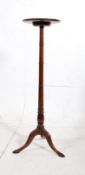 Edwardian tall mahogany torchere / plant stand / jardiniere. The ring turned stem on three splayed