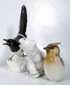 Lomonsov USSR 1960's porcelain figurines to include a magpie, wax wing, polar bear cub, all with