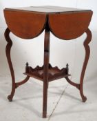 An Edwardian mahogany envelope drop leaf occasional table. Two tiers, the lower having a fret carved