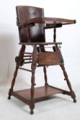 A 19th century mahogany childs high chair. Turned supports with panelled seat having hole to centre,
