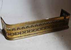 A Victorian brass fret pierced fire fender kerb. Rolled brass top and base with fret pierced