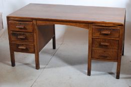 A good 1930's Air Ministry oak office desk. Squared legs with drawers to each pedestal having a good