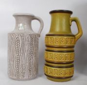 Two decorative West German vases, with markings to base. 26cm & 24cm tall.