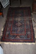 An antique Persian rug.