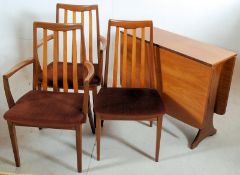 A G-Plan teak drop leaf dining table together with 3 chairs including 2 carvers. G-plan labels to