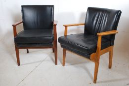 2 1960's black leather Parker Knoll office armchairs together with a similar black leather office