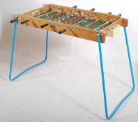 A retro original Triang fusball / football table top game on tubular painted metal supports having