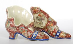 A pair of 20th Century Satsuma style Oriental / Chinese models of shoes. Decorative colourful design