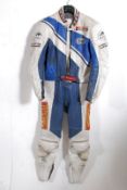 A 2 piece motorcycle racing leathers / suit by Heing encke having sponsor patches to the two two