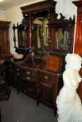 A large Edwardian bow front mirror back sideboard / dresser. The base, having end cupboards flanking
