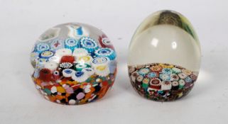 2 good quality Millefiori glass paperweights of decorative design. Unsigned.