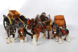 5 porcelain Shire horses together with wooden carts.