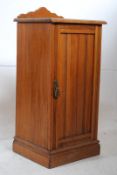 An Edwardian satin walnut pot cupboard / bedside cabinet. The plinth base having a full length
