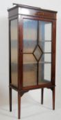 Edwardian mahogany inlaid display cabinet. The square tapered legs with spade feet supporting an