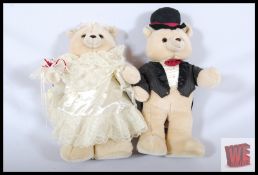 Two large Russ Berrie bride and groom teddy bears. 55cm tall.