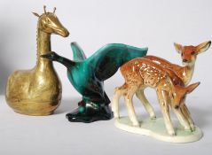 A German pottery model of two deer, along with a Canadian Blue Mountain goose and a hinged metal