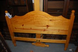 A large pine double bed complete with slats