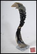A decorative African horn of a tribeman with signature of 'Cuba' to the lower side. 42cm high.
