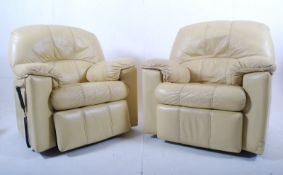 2 large contemporary cream leather electric reclining armchairs. The remote operated chairs