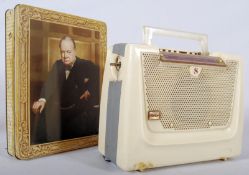 A 1950's Stella radio transistor together with a Huntley & Palmers biscuit tin having Winston