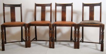 4 1930's Art Deco solid oak panel back dining chairs. The turned legs united by stretchers with drop