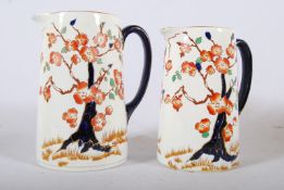 A Lawleys (17.5cm) and Royal Ventons (19.5cm) Staffordshire Imari pattern jugs. Blue handles with