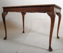 1930's burr walnut extending dining table.Cabriole legs with pad feet supporting an extending