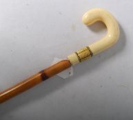 An early 20th century sword walking stick with bone and shagreen handle with a cane shaft.
