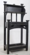 A Victorian carved oak jacobean revival hall stand. The squared supports having finials atop with