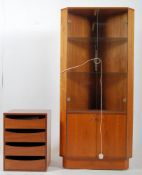 A retro 1970's smoked glass and teak wood danish corner cabinet having large glazed doors with