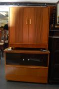 A 1970's teak wood record / hi-fi unit together with 1 other entertainment cabinet