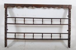 An 18th century carved oak delft kitchen dresser rack. Shaped cornice over shelves beneath. H88cm