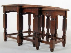 A 1920's oak arts and crafts nest of tables. H47cm x W51cm x D35cm.