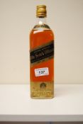 A square bottle for 'Extra Special Old Scotch Whisky, Black Label' by Johnnie Walker. Sealed, with