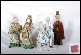 A collection of chinese figurines together with a continental glazed bisque figurine (4)