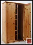 A pine display cabinet with built in sliding shelves. H116cm x W64cm x D39cm