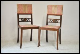 2 Edwardian mahogany inlaid dining chairs. The square tapered legs having upholstered seats and