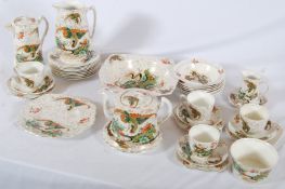 A Thomas Forester & Sons Phoenix ware tea service to include teapot and stand, creamer etc along