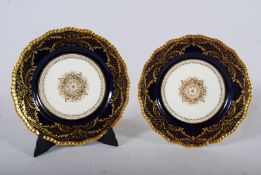 2 Royal Doulton cabinet plates having a cobalt blue and gilt border with centre white panel and