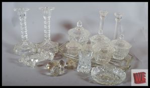 A dressing table set along with two pairs of candle sticks, knife rests and other bits.