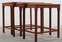 A 1970's Danish retro teak and tile top nest of graduating tables. Decorative tiled tops on shaped