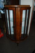 1930's Art Deco burr walnut demi-lune bookcase display cabinet. Small proportions with pad feet on