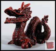 A Chinese carved resin dragon figurine