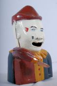 A 20th century painted cast iron money box being painted and in the form of Pierrot / clown. 20cms