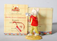 A Royal Doulton Rupert Bear figurine with certificate, in box. 13cm tall.