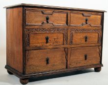 1930's Jacobean revival oak chest of drawers. The bun feet supporting a low chest having 3 drawers