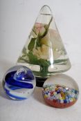 A 20th century English glass paperweight with Milliefiori canes, a blue and white glass swirl