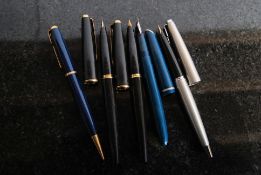 A collection of vintage fountain pens, mainly Parker along with a Parker propelling pencil, and