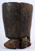 A 19th African tribal art hardwood beaker of rustic form having terraced base, unusual arch to